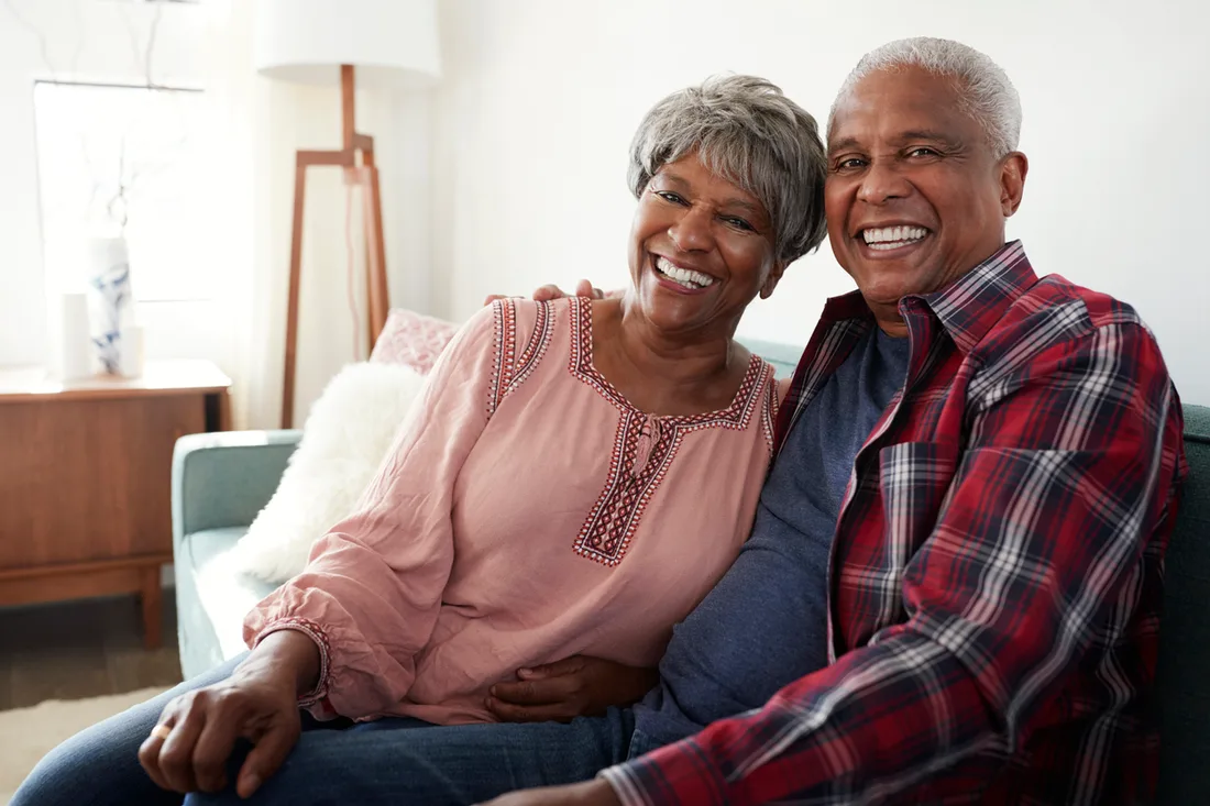 Home 1 Senior Black couple smiling together at home